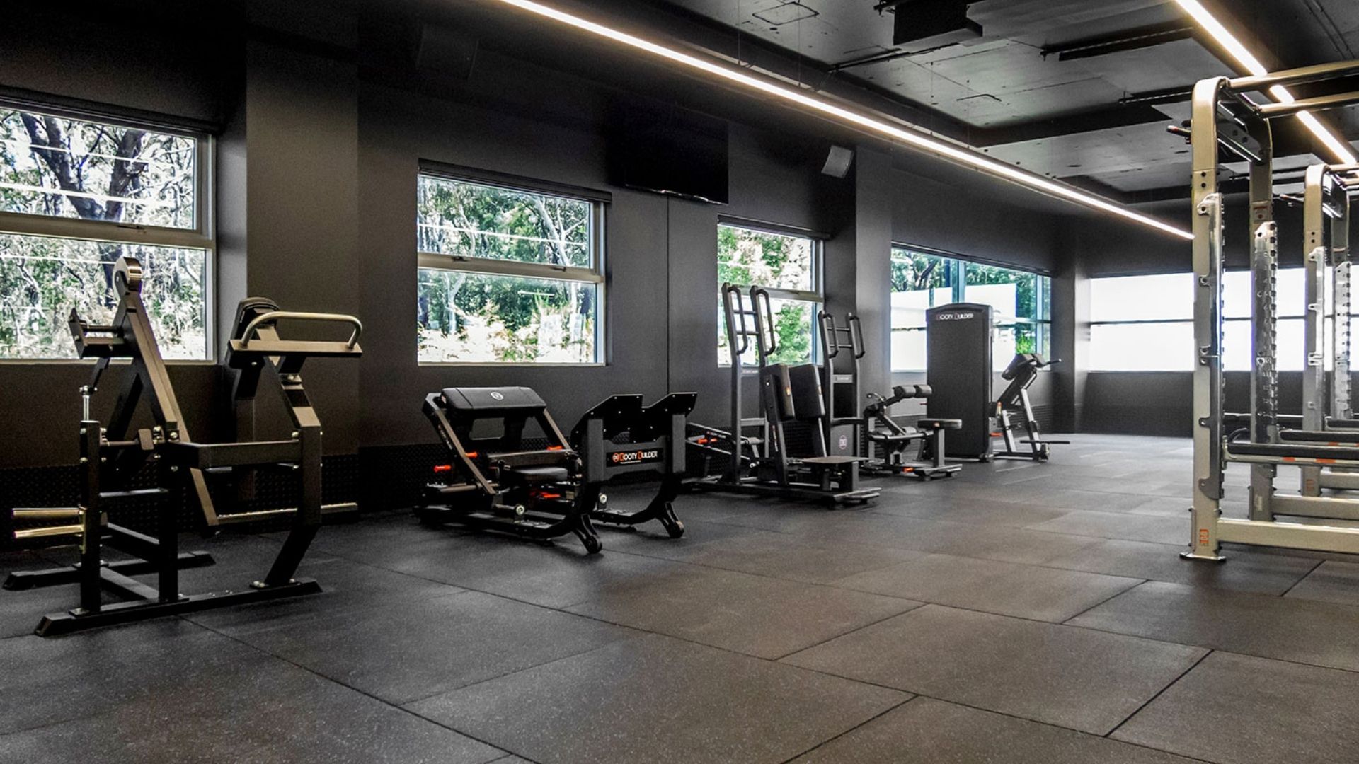 Lower body machines beside bushland windows