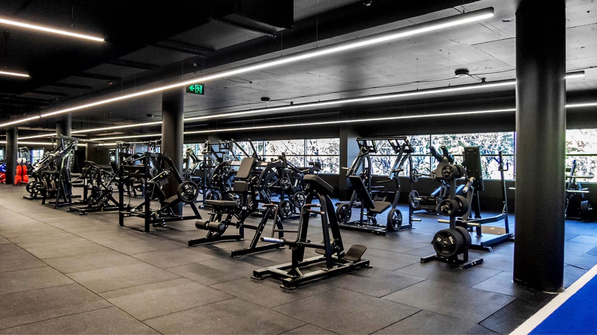 Long row of machines under linear lighting