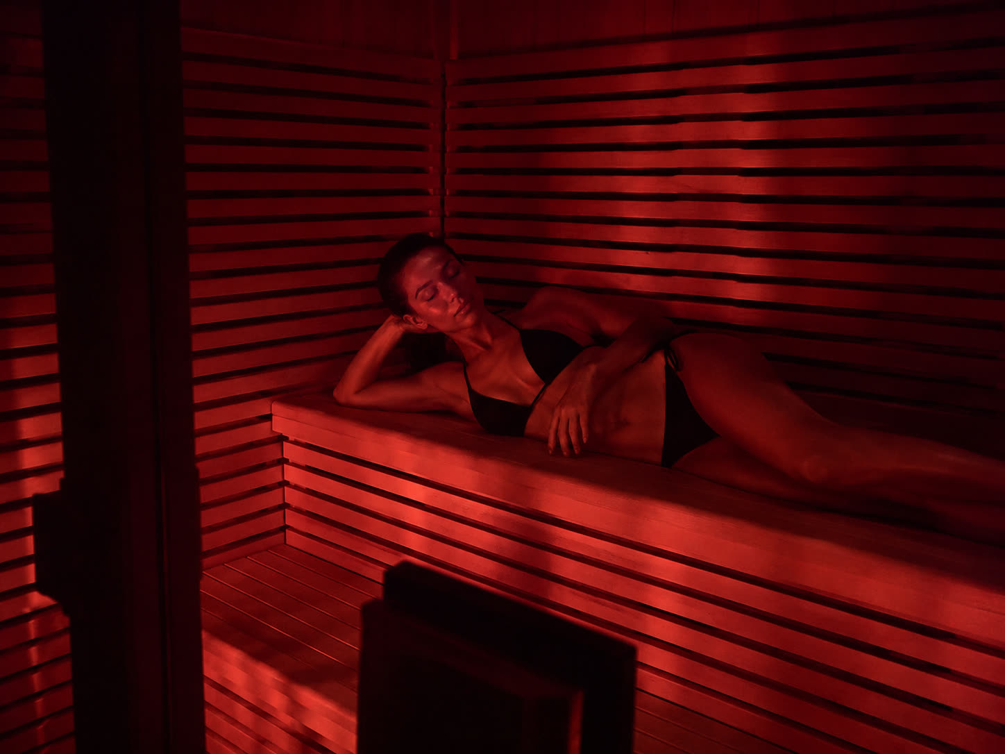 Infrared sauna interior lit warm red